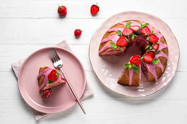 Composition Plates Tasty Strawberry Cake Light Wooden Background —  Fotos de Stock