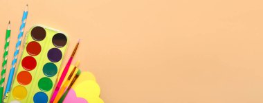  School stationery on beige background with space for text, top view
