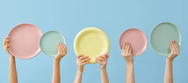 Hands Different Clean Plates Blue Background — Stock Photo, Image