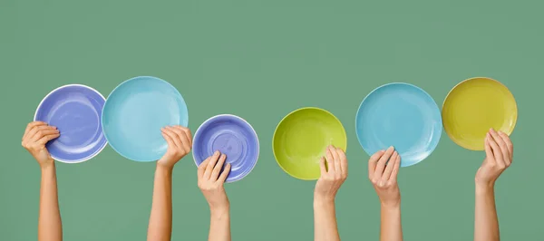 Hands Different Clean Plates Green Background — Stock Photo, Image