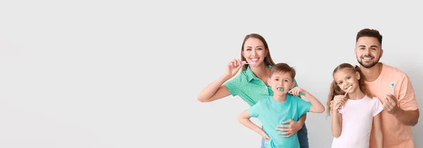 Portrait Happy Family Brushing Teeth Light Background Space Text — Stok fotoğraf