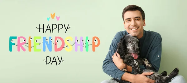 Young Man Cute Dog Color Background Happy Friendship Day — Stockfoto