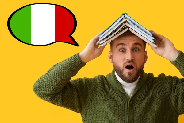 Surprised Young Man Books Yellow Background Studying Italian Language — Fotografia de Stock