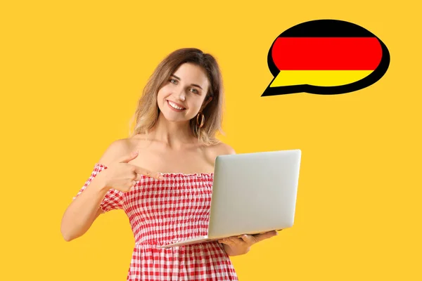 Young Woman Laptop Yellow Background Concept Studying German Online — Stockfoto