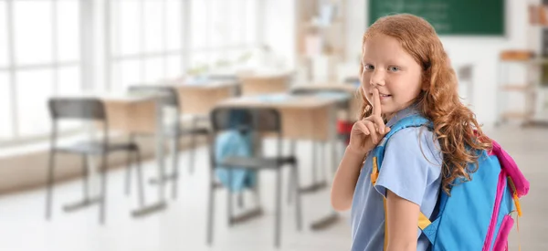 Cute Little Redhead Schoolgirl Showing Silence Gesture Classroom — Stockfoto