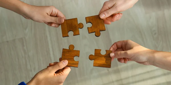 People Assembling Wooden Puzzle Top View — Photo