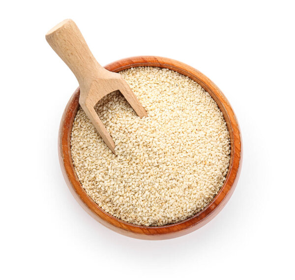 Wooden bowl with sesame seeds on white background