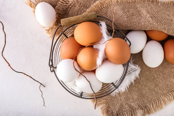 Basket Different Chicken Eggs Feathers Light Background — Stock Photo, Image