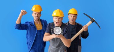 Protesting miner men on blue background