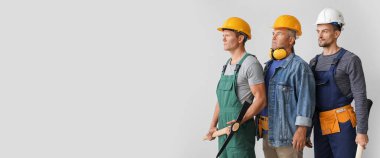 Miner men on light background with space for text