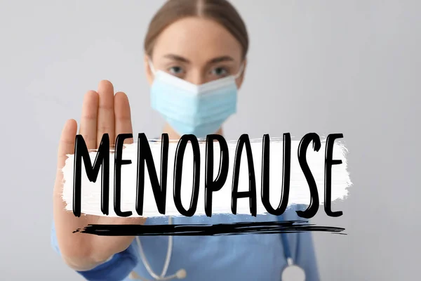 Female Doctor Showing Word Menopause Grey Background — Stock Photo, Image