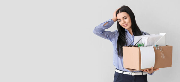 Sad fired woman on light background with space for text