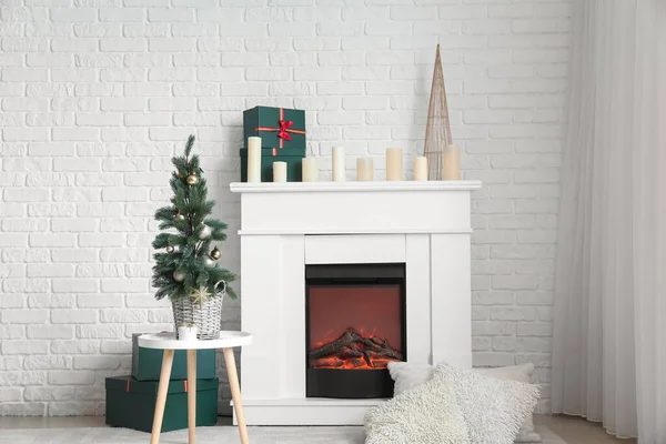 Electric Fireplace Candles Gift Boxes Christmas Tree White Brick Wall — Zdjęcie stockowe