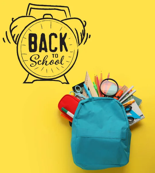 Backpack with stationery, drawn clock and text BACK TO SCHOOL on yellow background