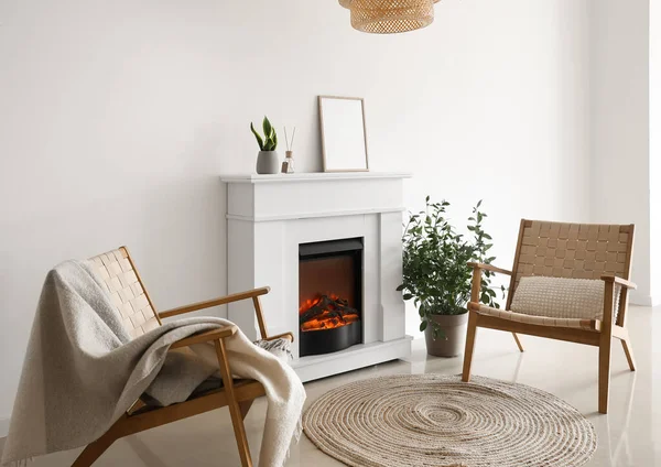 Modern Fireplace Blank Frame Houseplants Armchairs Light Wall — Stockfoto