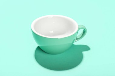 Cup for coffee on color background
