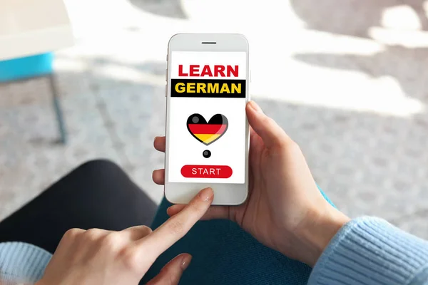 Young Woman Mobile Phone Studying German Online Closeup — Stockfoto