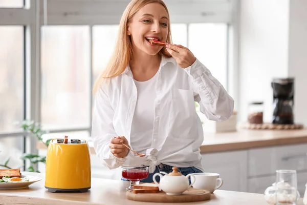 Mature Woman Eating Tasty Toasts Kitchen — 스톡 사진