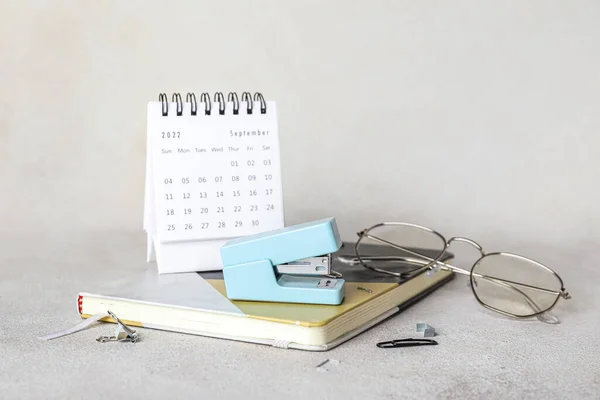 Stapler Stationery Eyeglasses Calendar Light Background —  Fotos de Stock