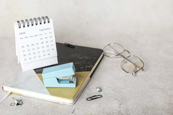 Stapler Stationery Eyeglasses Calendar Light Background — Stockfoto
