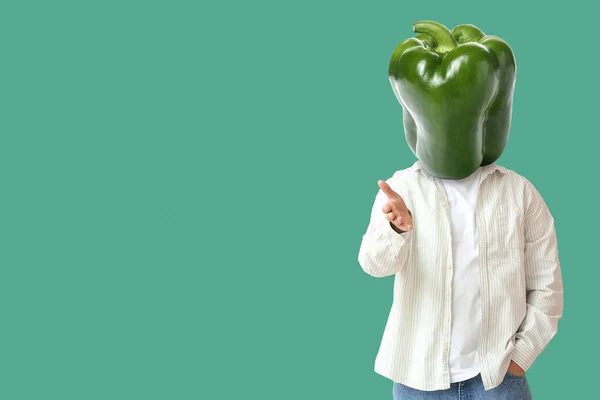 Young Man Fresh Bell Pepper Instead His Head Green Background — Stockfoto