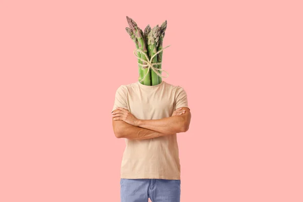 Young Man Fresh Asparagus Instead His Head Pink Background — Φωτογραφία Αρχείου