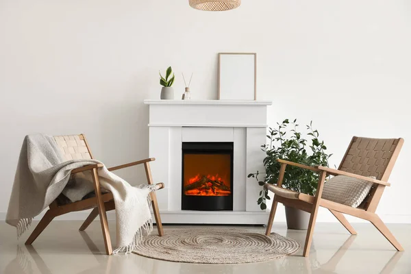 Modern Fireplace Blank Frame Houseplants Armchairs Light Wall — Stok fotoğraf