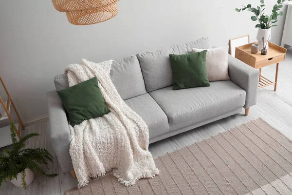 Grey Sofa Cushions Plaid Light Wall — Stock Photo, Image