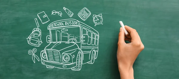 Hand drawing school bus and stationery on blackboard