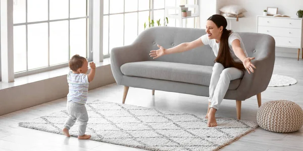 Mother Teaching Her Cute Baby Walk Home — Stock Photo, Image