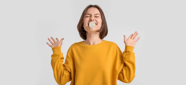 Funny Young Woman Chewing Gum Light Background — Stock Photo, Image