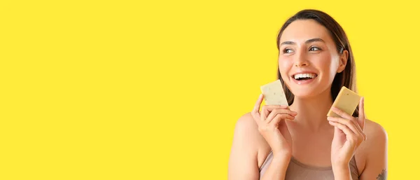 Beautiful Young Woman Holding Soap Bars Yellow Background Space Text — Stock Photo, Image