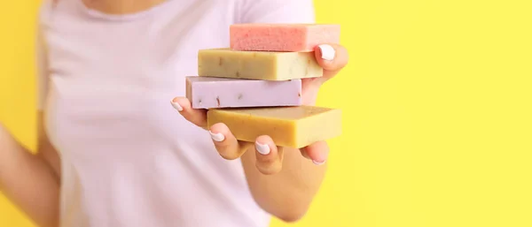 Young Woman Holding Soap Bars Yellow Background Space Text Closeup — Zdjęcie stockowe