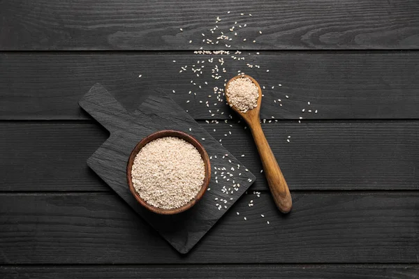 Board Bowl Spoon Sesame Seeds Dark Wooden Background — Stock Photo, Image