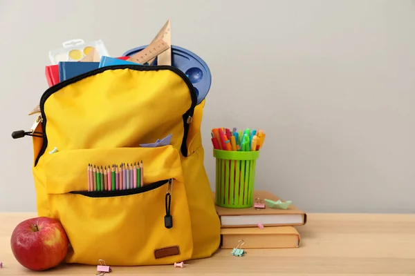 School Backpack Stationery Apple Table Grey Background — 스톡 사진