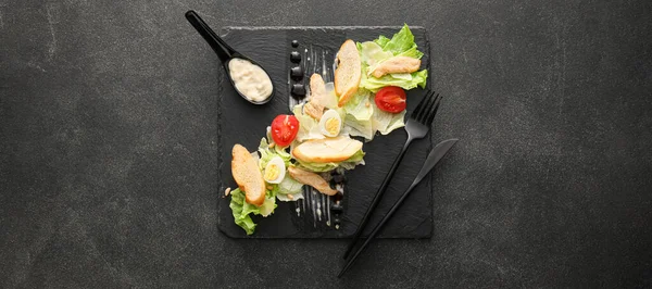 Slate Plate Tasty Caesar Salad Black Background Top View — Φωτογραφία Αρχείου