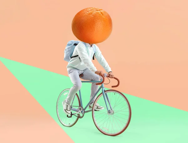 Student Ripe Grapefruit Instead His Head Riding Bicycle Color Background — Stock fotografie