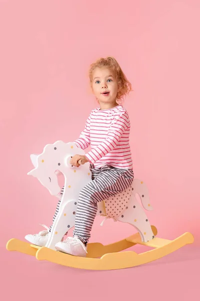 Adorable Little Girl Bunny Ears Rocking Horse Pink Background — Stockfoto