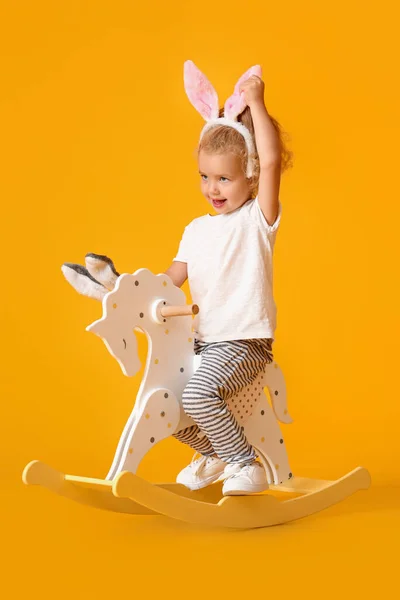 Adorable Little Girl Bunny Ears Rocking Horse Yellow Background — Stock Photo, Image