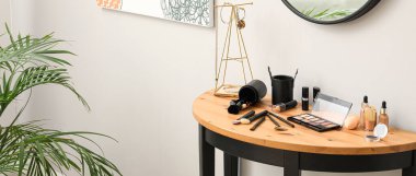 Set of decorative cosmetics on table of makeup artist in beauty salon