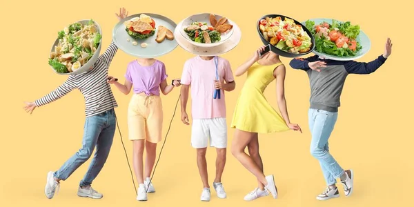 Different People Plates Tasty Caesar Salad Instead Heads Color Background — Stock Photo, Image