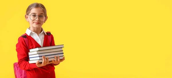 Cute Little School Girl Holding Books Yellow Background Space Text — Stockfoto