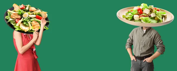 Young People Plates Tasty Caesar Salad Instead Heads Green Background — Stock Fotó