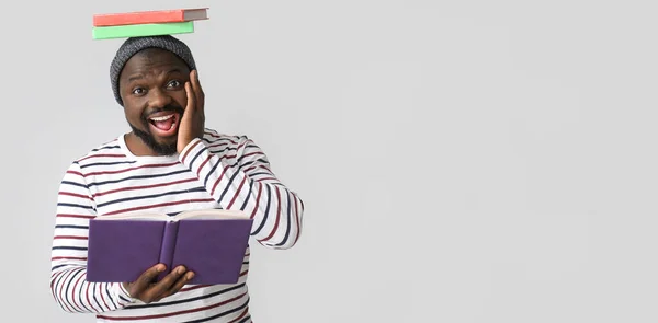 Surprised African American Man Reading Books Light Background Space Text — Fotografia de Stock