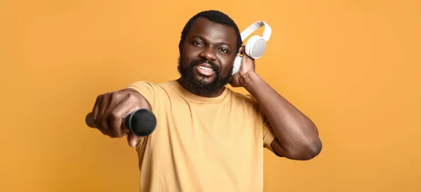 Male African American Singer Headphones Microphone Orange Background — Stock Photo, Image