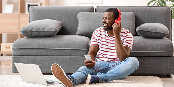 Handsome African American Man Phone Laptop Listening Music Home — Stock Photo, Image