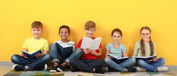 Cute Little Children Reading Books Yellow Background — Stok fotoğraf