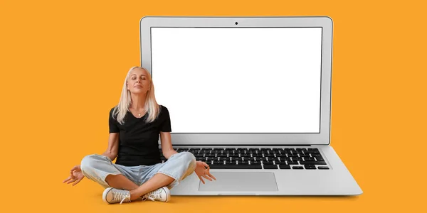 Meditating Mature Woman Big Laptop Yellow Background — 图库照片