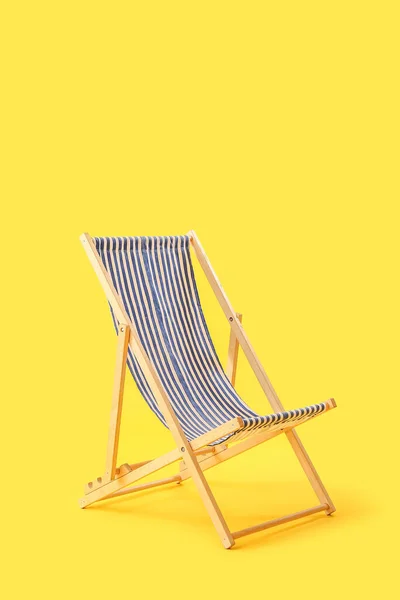 Wooden Deck Chair Yellow Background — 스톡 사진