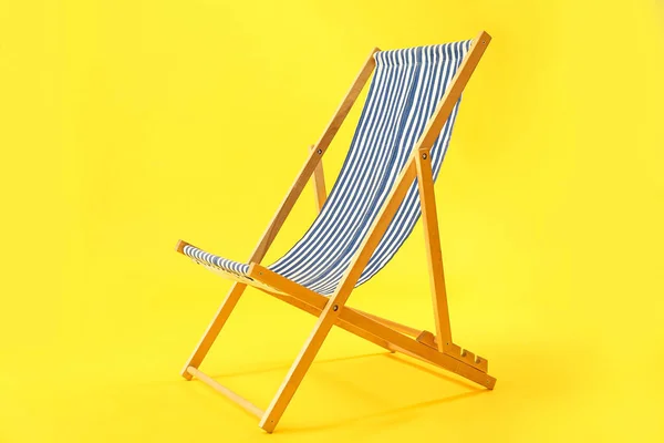 Wooden Deck Chair Yellow Background — 스톡 사진